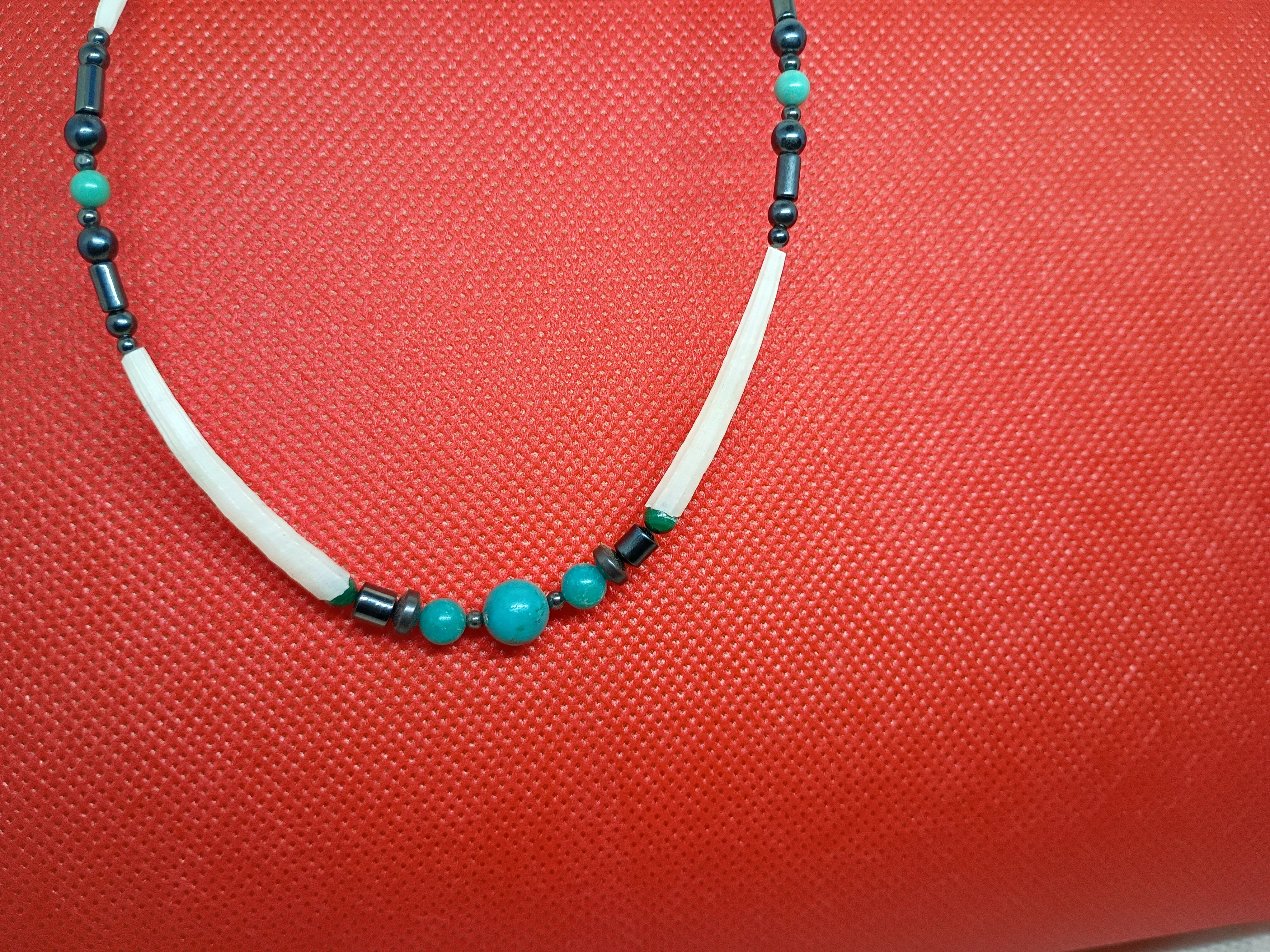 Approx. 20" a handcrafted beaded necklace w/ long white hair pipe bone beads