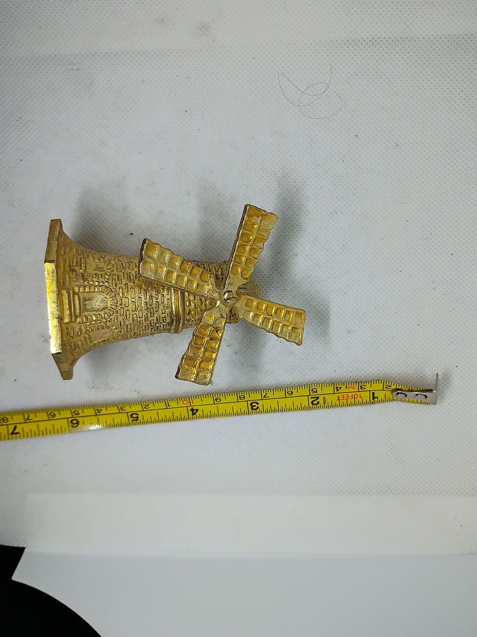 Thumbnail: 4" tall vintage brass bell shaped like a Windmill