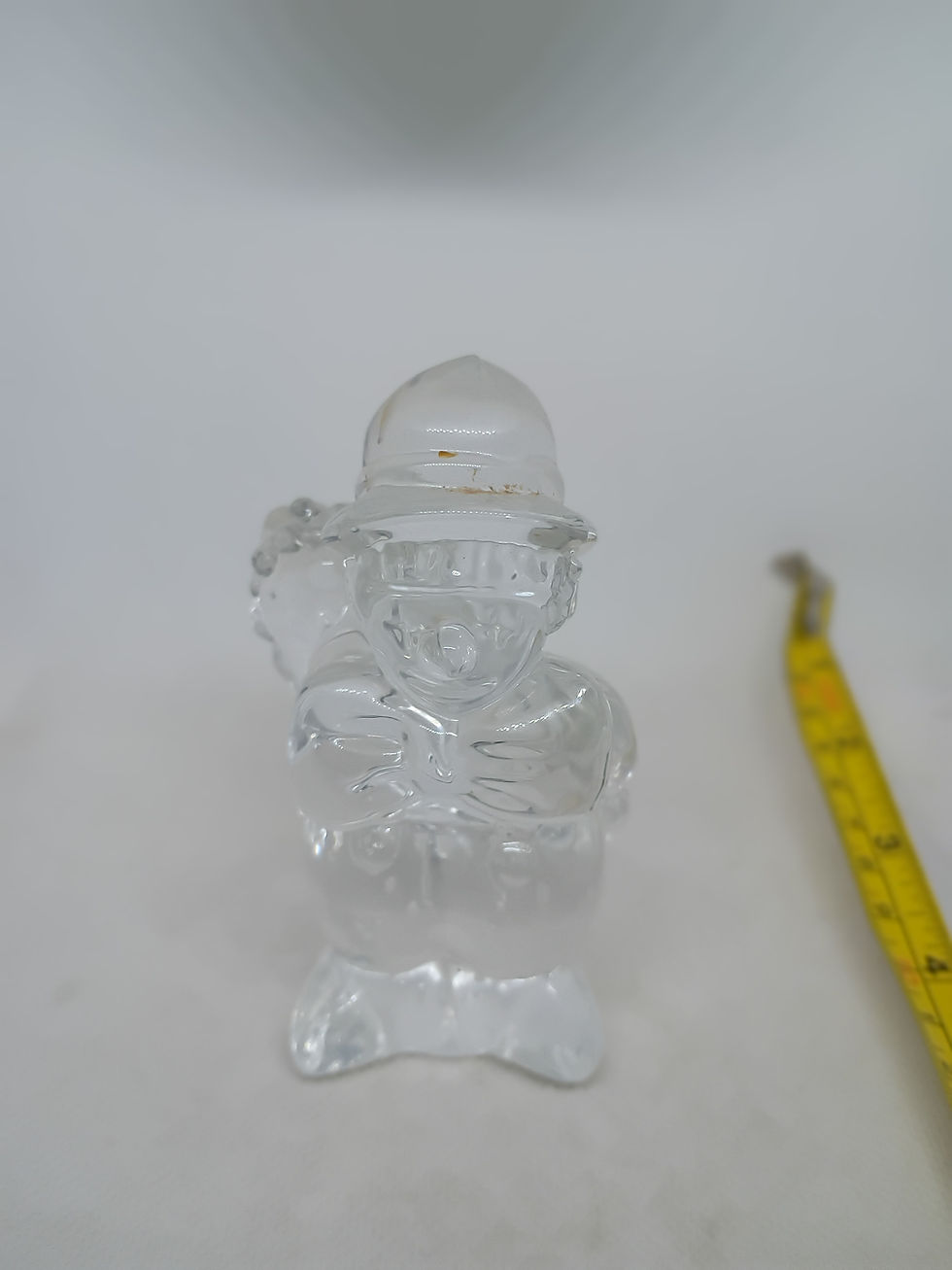 Thumbnail: 4" tall- Clear glass man hiding a bouquet of flowers behind his back