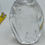 Thumbnail: 4" rocket shaped clear cut glass paperweight- flower design