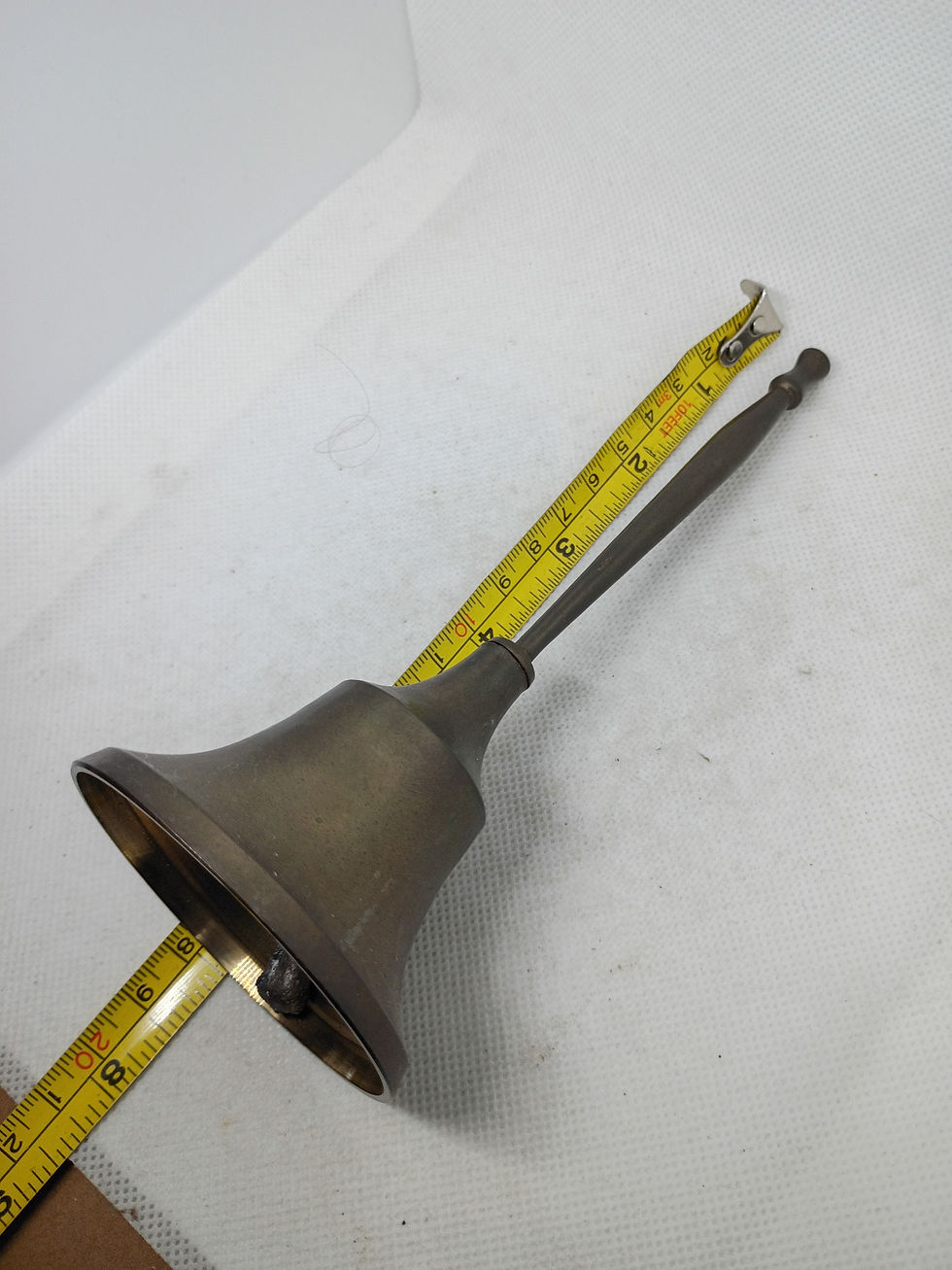 Thumbnail: 7" tall vintage brass bell with slender brass handle