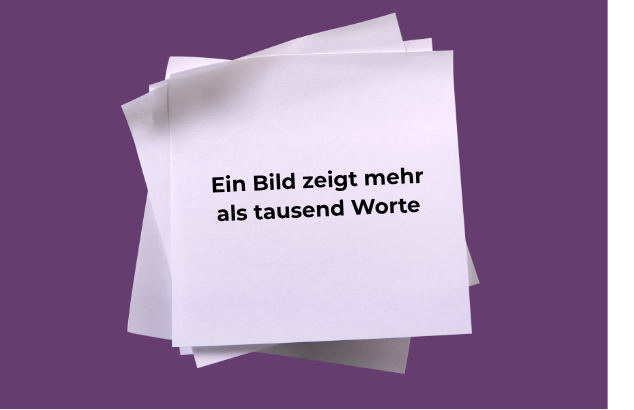 Weisse Notizzettel auf violettem Hintergrund mit dem Text „Ein Bild zeigt mehr als tausend Worte“.