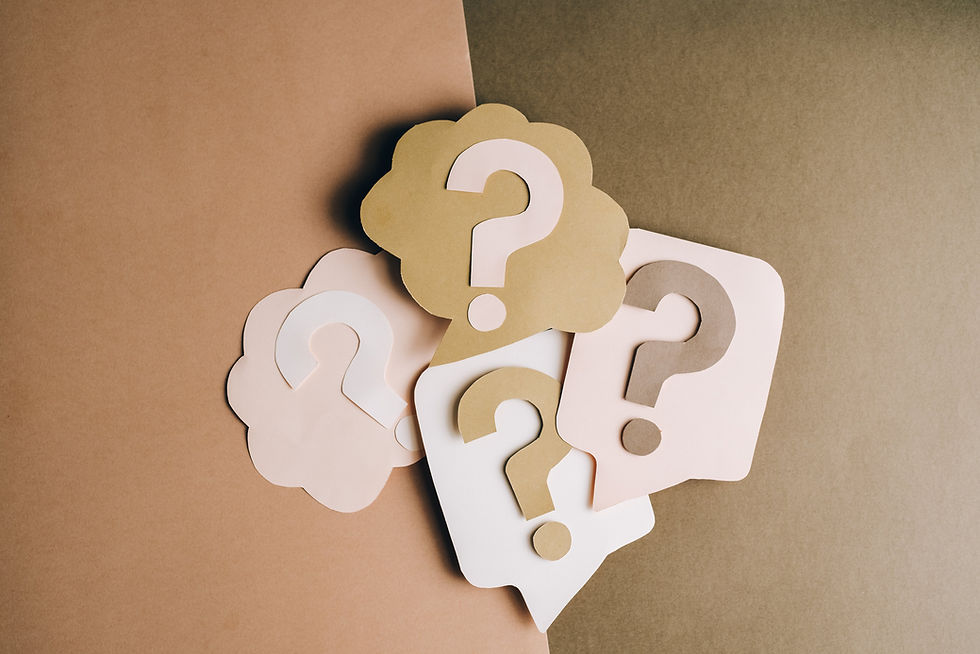 A number of question marks with a dual-tone brown background
