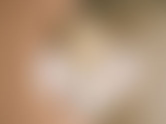 Four question marks on a brown background.