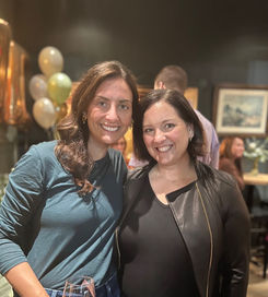 2 women at The House That She Built booth