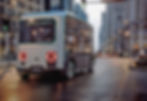 Artist concept of HOLON Mover vehicle rolling through city streets.