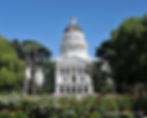 Front view of California State Capitol building under blue skies