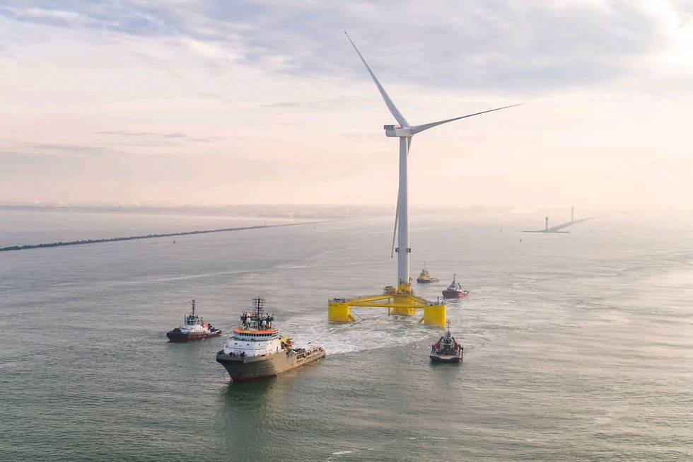 FOSW turbine being towed by a ship to a wind farm.