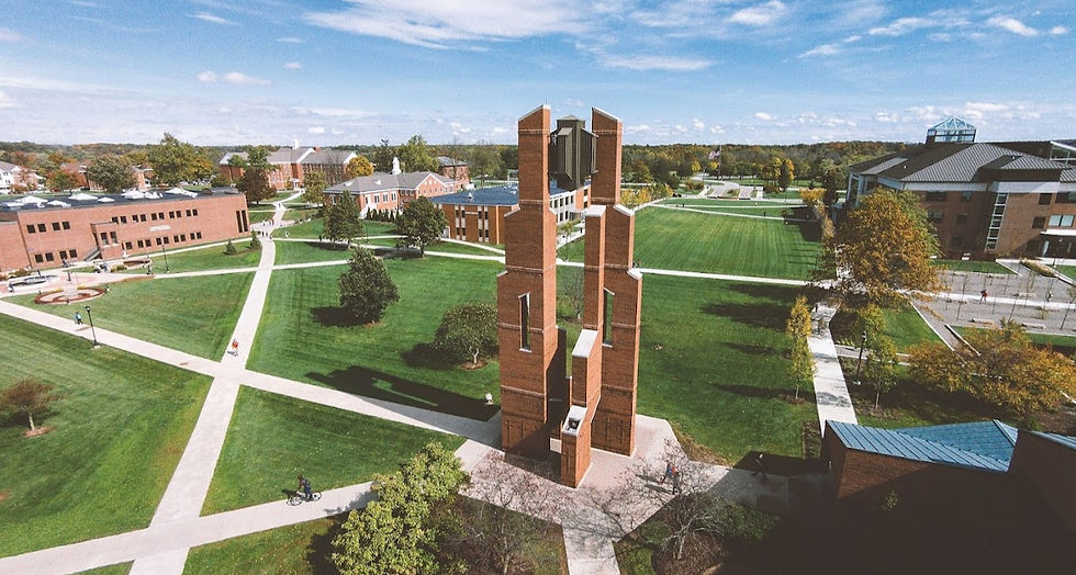 Aerial view of Taylor University campus in Fort Wayne, Indiana under blue sky and high scattered clouds