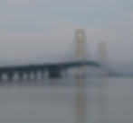 Mackinac Bridge nestled in early morning fog.