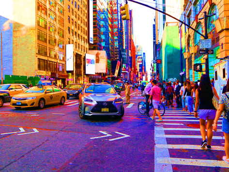 Busy Times square sidewalk with pedestrians, taxis all jockeying for position