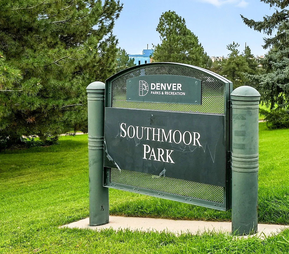 Sign for Southmoor Park by Denver Parks & Recreation, set against lush green grass and trees under a clear blue sky.