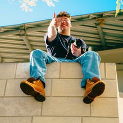 Guy looks down on camera 