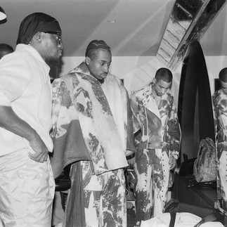 group of male models standing around set