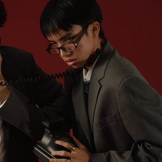 Man with glasses wearing suit