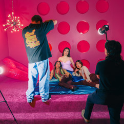 Behind the scenes of a photoshoot in a red room