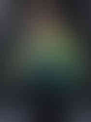 Emo boy wearing graphic hoodie with dark pants on runway