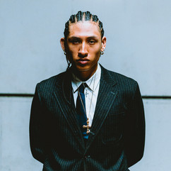 Portrait of man in black suit