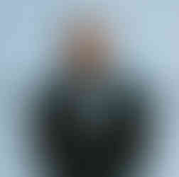Portrait of man in black suit