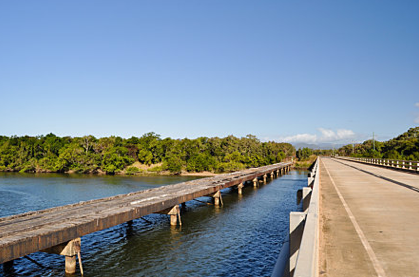 The original old wooden bridge [now heritage] crossing the Annan River alongside the new
