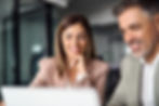 smiling-business-woman-working-on-laptop-with-male-2025-02-11-16-18-12-utc.jpg