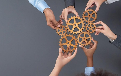office-worker-holding-cog-wheel-as-unity-teamwork-workplace-concord_31965-318040-transform