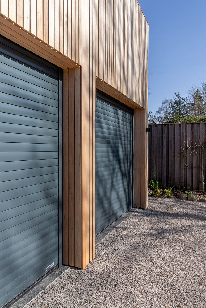 Hörmann RollMatic Roller Doors For Striking 9-Car Garage