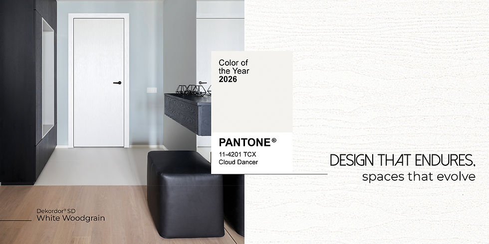 Modern interior with a white door, black furniture, and wood flooring. Pantone 2026 Color of the Year: Cloud Dancer. Text: Design that endures.
