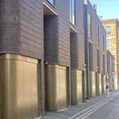Innovative Curved Side Sliding Garage Doors for Manchester Townhouses