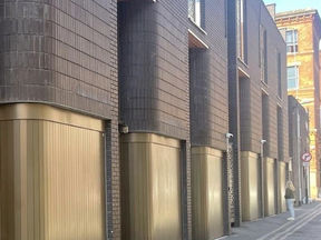 Innovative Curved Side Sliding Garage Doors for Manchester Townhouses