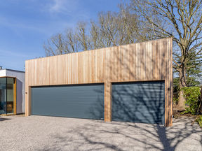 Okopod Selects Hörmann RollMatic Roller Doors For Striking 9-Car Garage