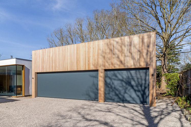 Hörmann RollMatic Roller Doors For Striking 9-Car Garage