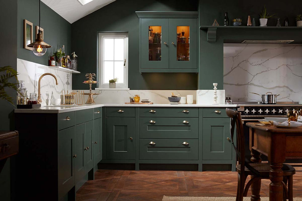 Elegant kitchen with dark green cabinets, marble backsplash, and wooden floor. Brass fixtures, window light, and shelves with decor add warmth.