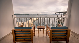 Hotel balcony with chairs overlooking the sea