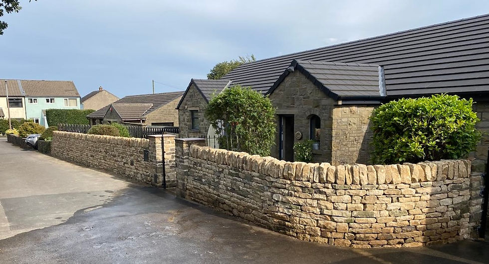 Ivy covered wall rebuilt by our team