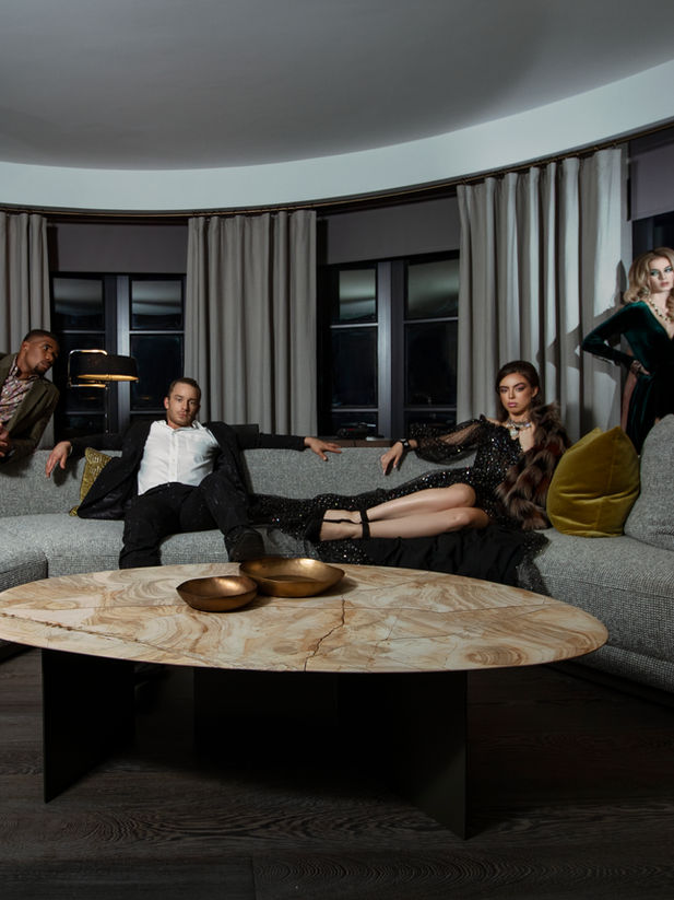 A group of models pose wearing vintage fashion in a themed photoshoot at the Hazelton Hotel in Yorkville, Toronto.