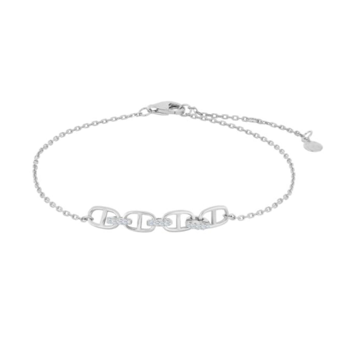 A bracelet featuring four H links combined with three small cubic zirconia links