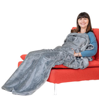 Oversized Silver Grey EzrAllora Lightweight Fleece Giant MovieMuff Foot Pocket Blanket worn by woman relaxing on the couch