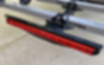 Thumbnail: Kody Technologies bike rack light on a Thule T2 Classic bike rack, isometric view, close up.  .