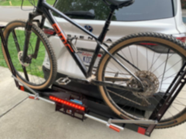 Kody Light on a Quik Rack Mach 2 bike rack and a white Toyota Sienna.