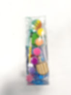 Complete Hanukkah Dreidel Decorating Kit with paints, water game, and chocolate coins in a clear package.