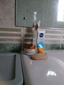 An image of skincare products on a bathroom sink
