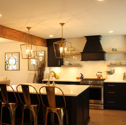 Black cabinets
White quartz countertops