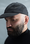 portrait of Reza Nik wearing basball hat