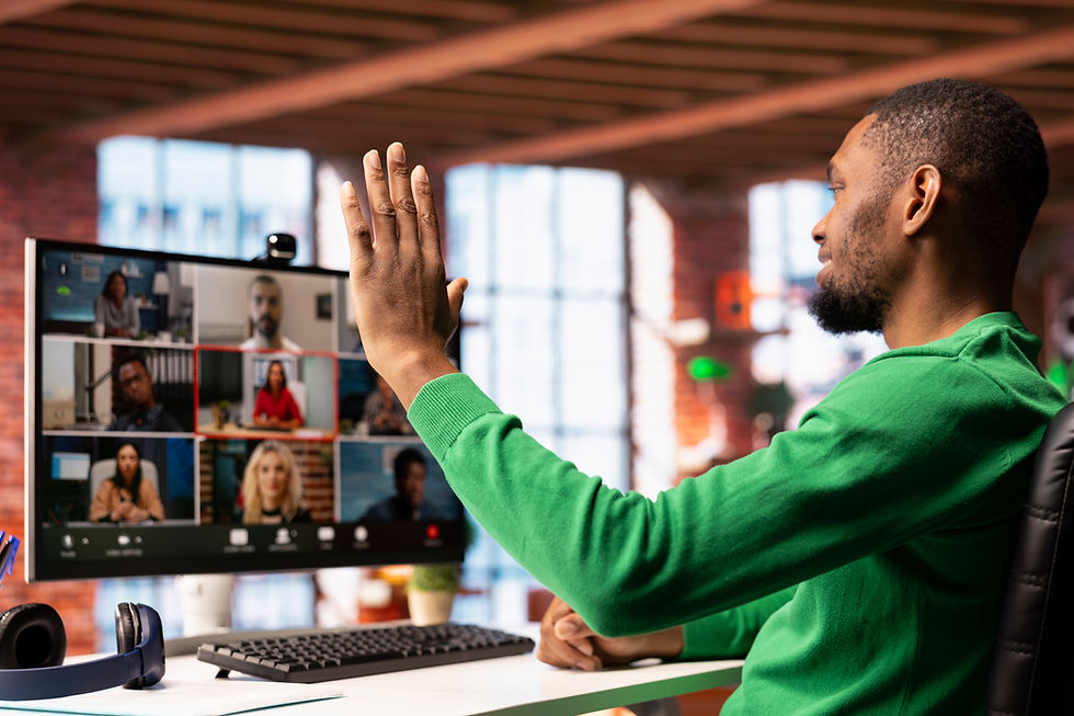 remote-worker-home-office-saluting-colleagues-online-videocall.jpg