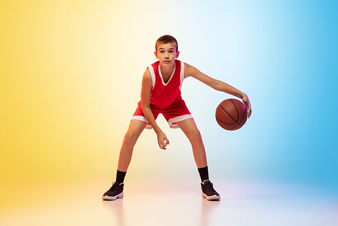 full-length-portrait-young-basketball-player-uniform-gradient-wall.jpg