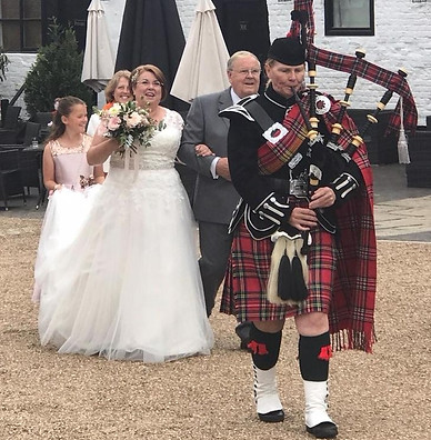 Bagpiper Julia Read parading bride Helen Smith to Kings Chapel in Amersham