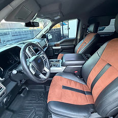 View of a car's Express Interior with black and brown seats