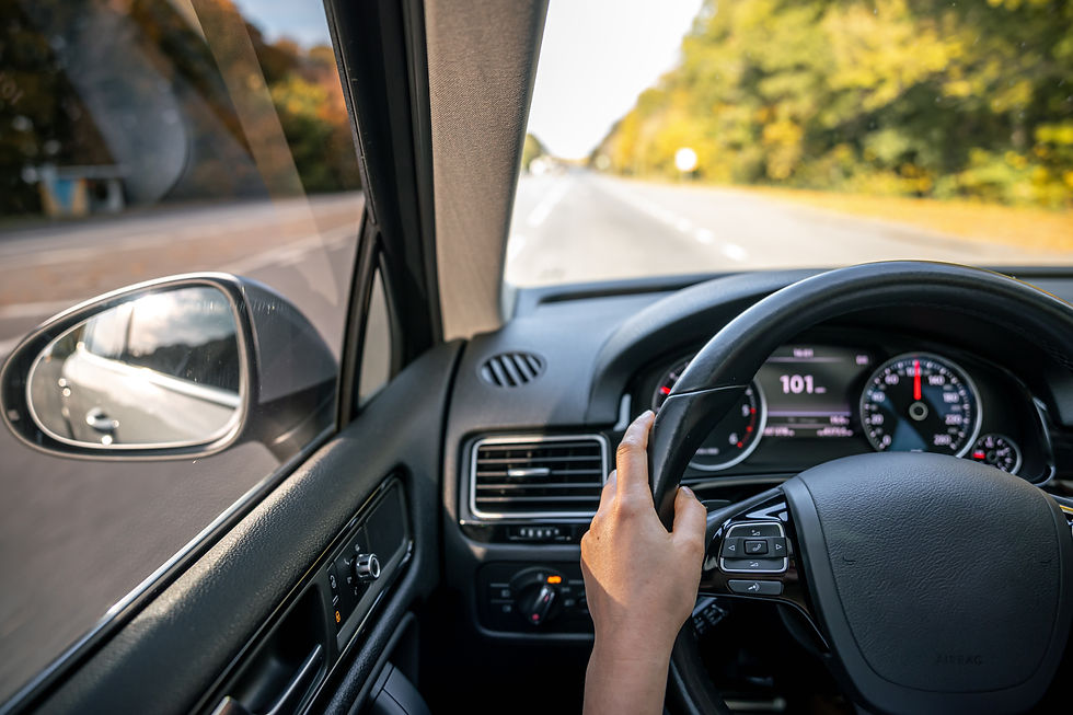 woman-drivers-hands-steering-wheel-inside-car.jpg