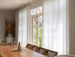 soft sheer curtains in neutral dining and living room with christmas decorations